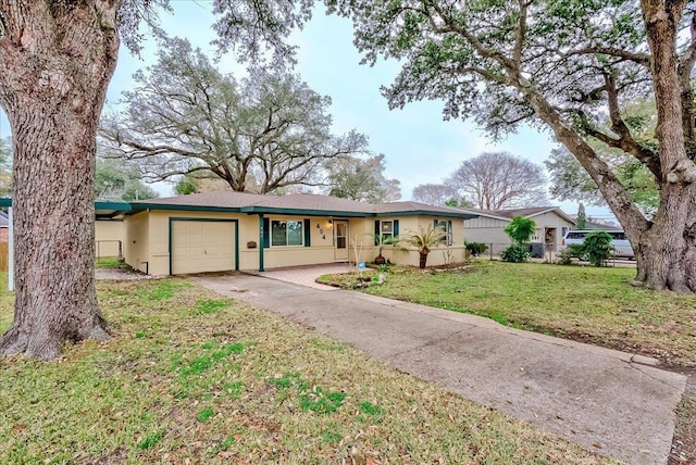 single story home featuring a garage and a front yard