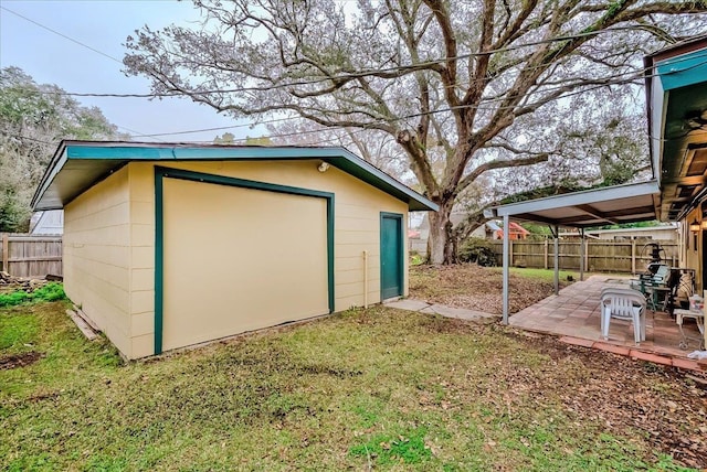 view of outbuilding with a yard