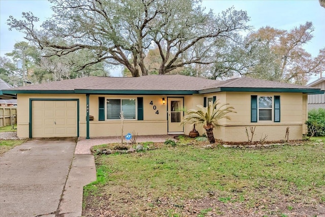 ranch-style home featuring a garage and a front lawn