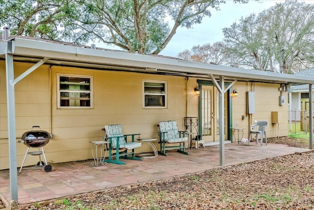 back of property featuring a patio area