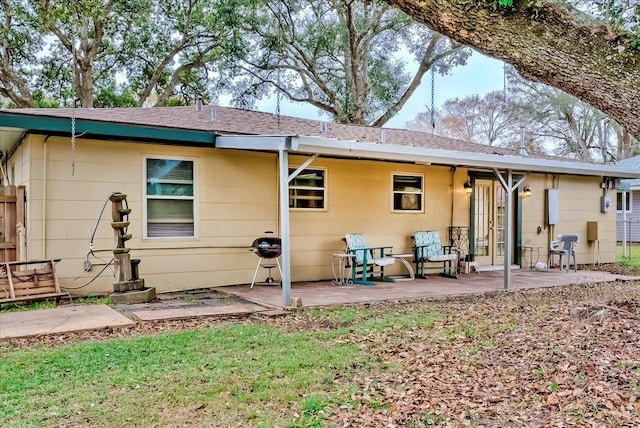 back of house with a patio area