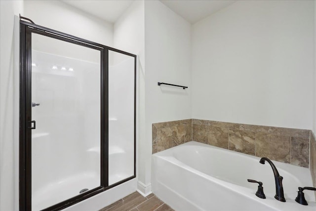 4406 Sequoia, Orange, TX 77630 - full bathroom featuring a shower stall, a bath, and wood finished floors