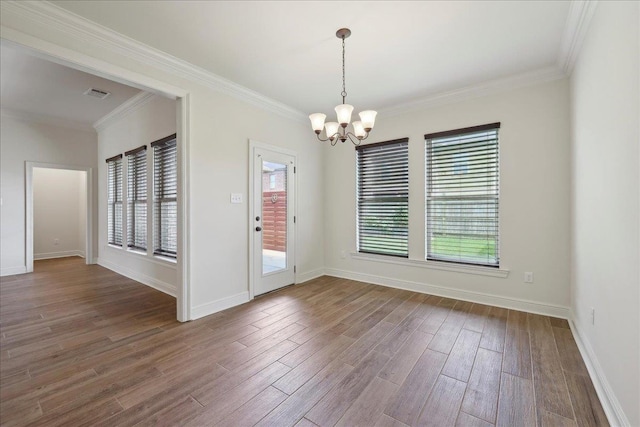 4406 Sequoia, Orange, TX 77630 - spare room featuring a chandelier, healthy amount of natural light, wood finished floors, and crown molding