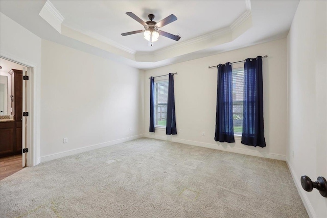 4406 Sequoia, Orange, TX 77630 - empty room with ornamental molding, a tray ceiling, light carpet, a ceiling fan, and baseboards