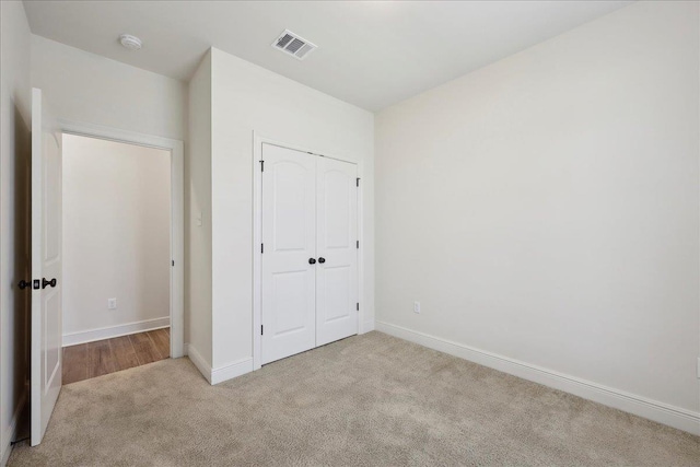 4406 Sequoia, Orange, TX 77630 - unfurnished bedroom featuring carpet flooring, a closet, and baseboards