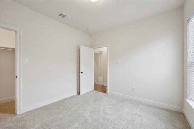 4406 Sequoia, Orange, TX 77630 - unfurnished bedroom featuring carpet, a spacious closet, baseboards, and a closet