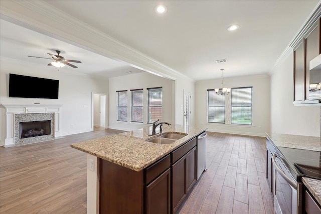 4406 Sequoia, Orange, TX 77630 - kitchen with a sink, open floor plan, stainless steel appliances, light wood-style floors, and crown molding