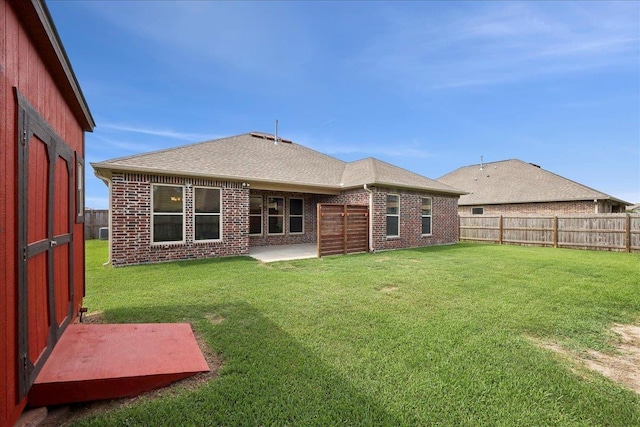 4406 Sequoia, Orange, TX 77630 - back of property with brick siding, a patio area, and roof with shingles