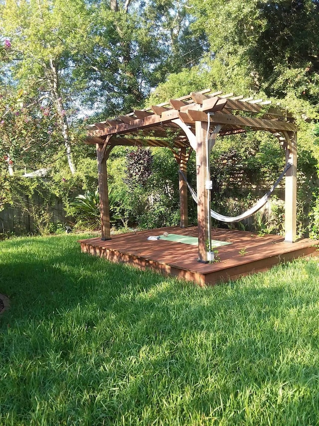 surrounding community featuring a yard and a wooden deck