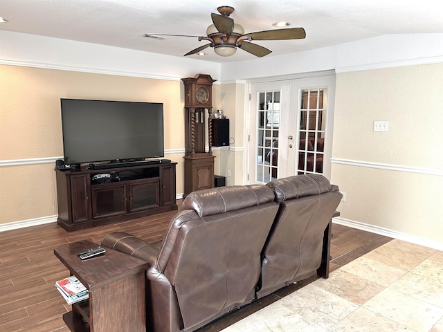 living room featuring ceiling fan, lofted ceiling, and french doors