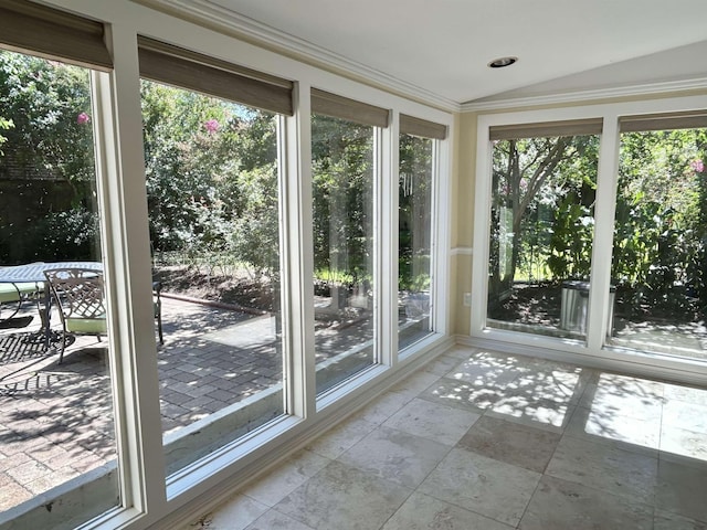 unfurnished sunroom with vaulted ceiling