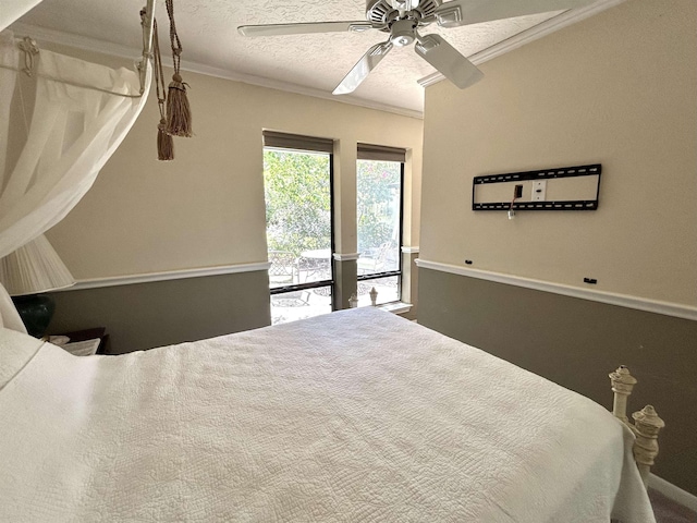 bedroom with access to exterior, a textured ceiling, ceiling fan, and ornamental molding