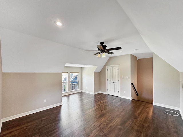 additional living space featuring ceiling fan, dark wood-type flooring, and lofted ceiling