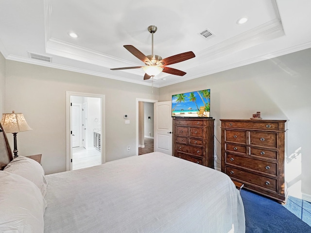 bedroom featuring carpet floors, a tray ceiling, ceiling fan, and crown molding