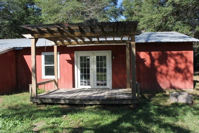 view of outbuilding with a lawn and a pergola