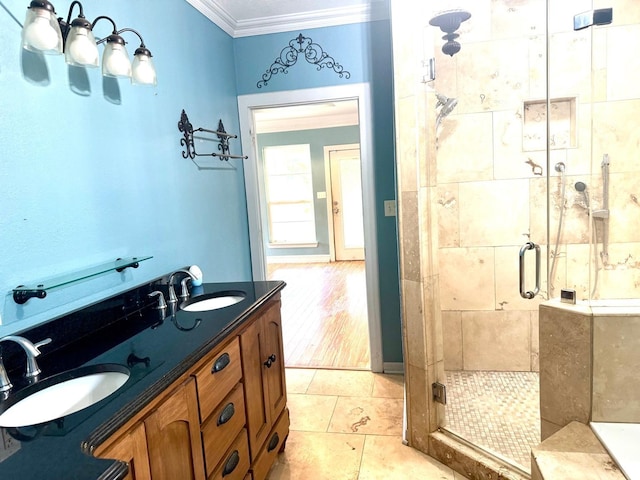 6748 Jefferson Blvd, Groves, TX 77619 - full bathroom featuring crown molding, a shower stall, and double vanity