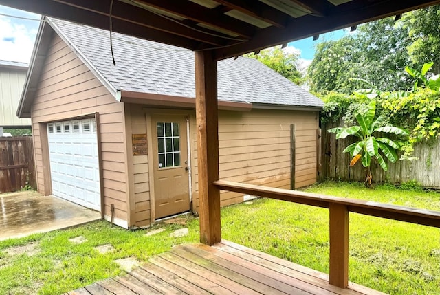 6748 Jefferson Blvd, Groves, TX 77619 - wooden terrace with an outdoor structure and a garage