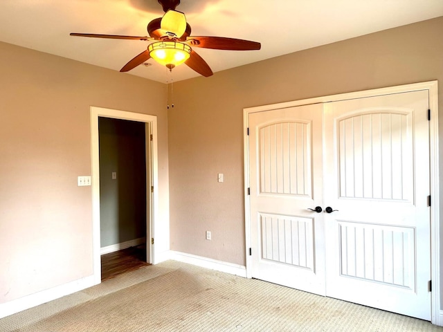6748 Jefferson Blvd, Groves, TX 77619 - unfurnished bedroom with light carpet, a closet, and ceiling fan