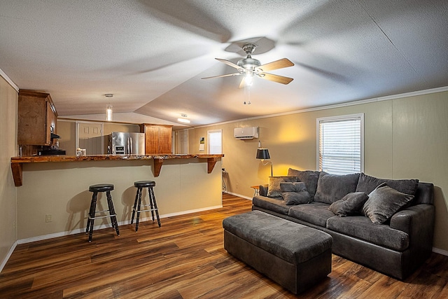 living room featuring a wall unit AC, ceiling fan, vaulted ceiling, and dark hardwood / wood-style floors