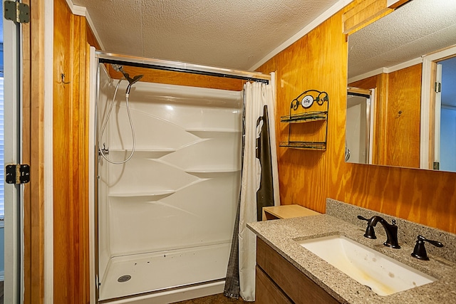 bathroom with vanity, curtained shower, crown molding, and wooden walls