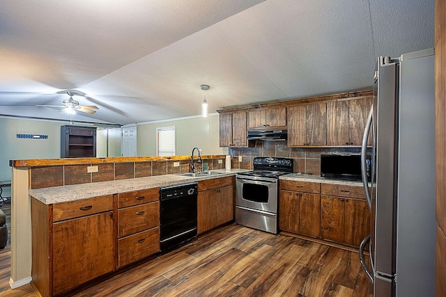 kitchen featuring backsplash, kitchen peninsula, sink, and black appliances