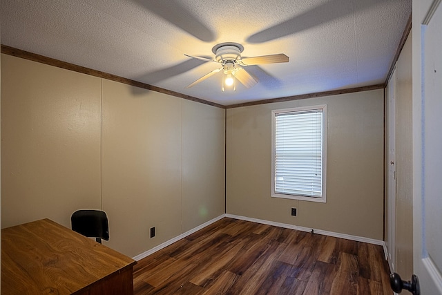 empty room with crown molding, dark hardwood / wood-style flooring, ceiling fan, and a textured ceiling