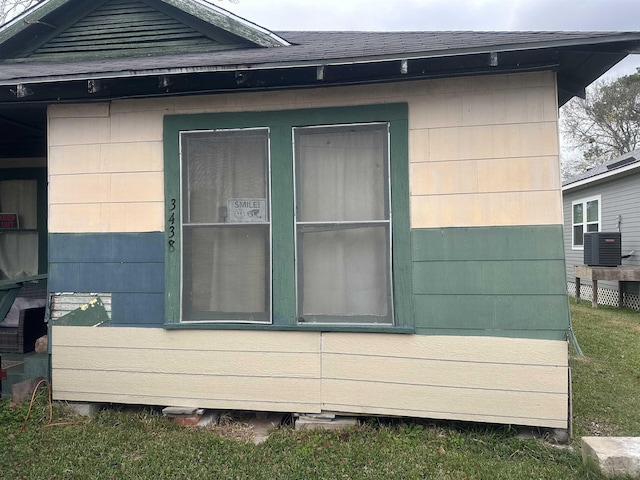 view of side of home featuring central air condition unit