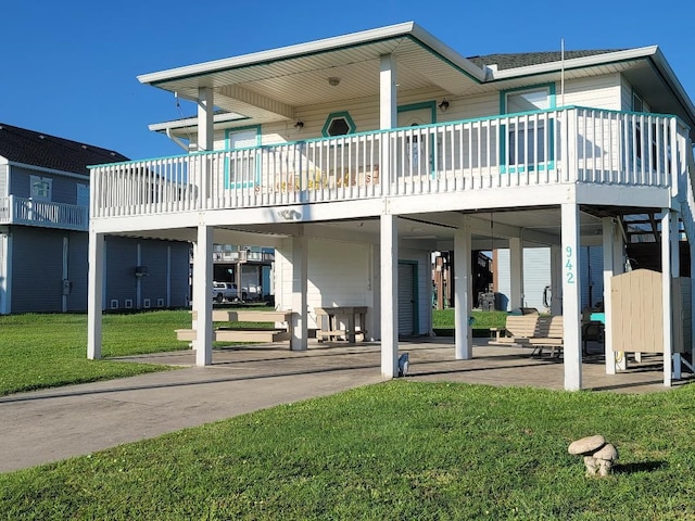 back of property featuring a patio area and a yard