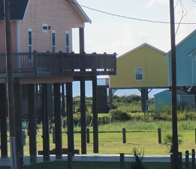 exterior space with a yard and a wooden deck