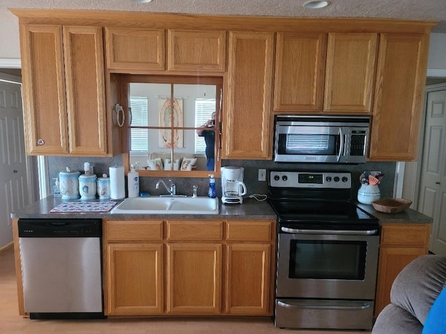 kitchen featuring sink, stainless steel appliances, and tasteful backsplash