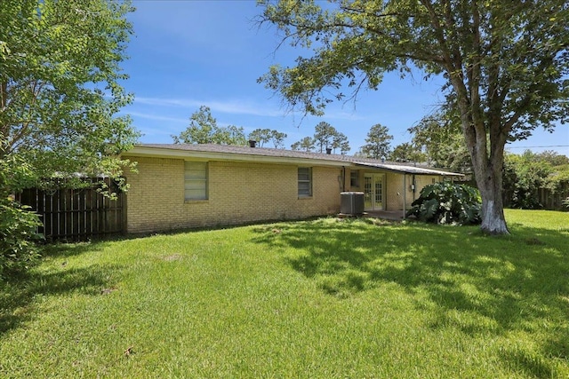 1336 Beagle Rd, Orange, TX 77632 - rear view of property featuring french doors and brick siding