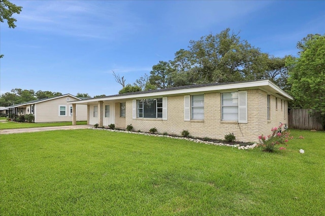 1336 Beagle Rd, Orange, TX 77632 - single story home with brick siding and concrete driveway