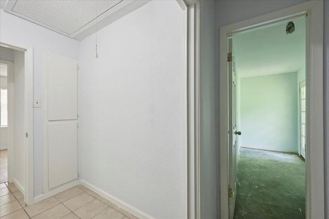1336 Beagle Rd, Orange, TX 77632 - corridor with light tile patterned floors and baseboards