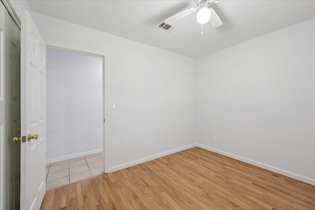 1336 Beagle Rd, Orange, TX 77632 - empty room featuring light wood-style flooring and a ceiling fan