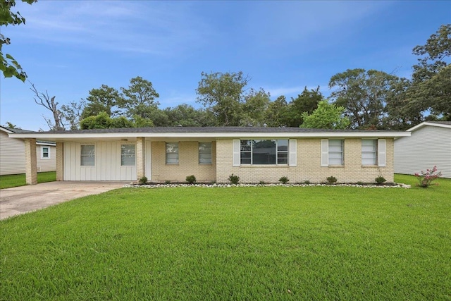 1336 Beagle Rd, Orange, TX 77632 - ranch-style house featuring board and batten siding, brick siding, and a front lawn