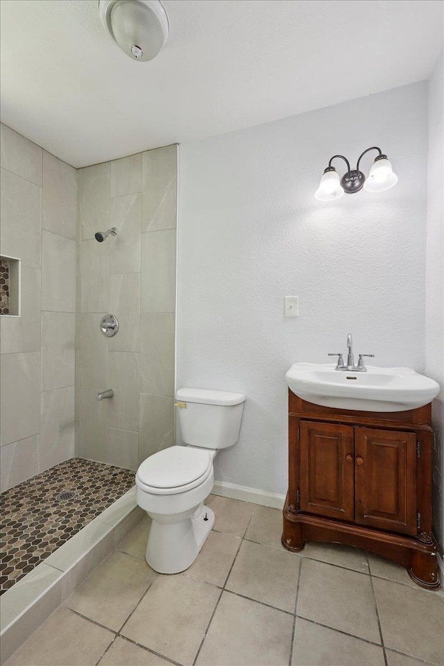 1336 Beagle Rd, Orange, TX 77632 - full bath featuring a tile shower, tile patterned flooring, and vanity