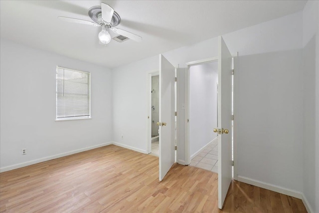 1336 Beagle Rd, Orange, TX 77632 - unfurnished bedroom with light wood finished floors and a ceiling fan