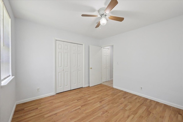 1336 Beagle Rd, Orange, TX 77632 - unfurnished bedroom with light wood finished floors, ceiling fan, and a closet