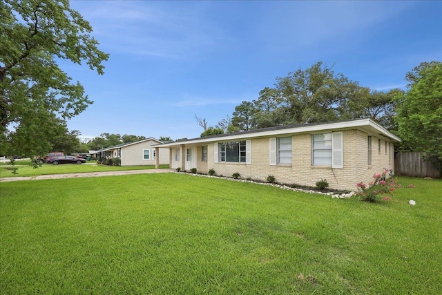1336 Beagle Rd, Orange, TX 77632 - ranch-style house with concrete driveway and brick siding
