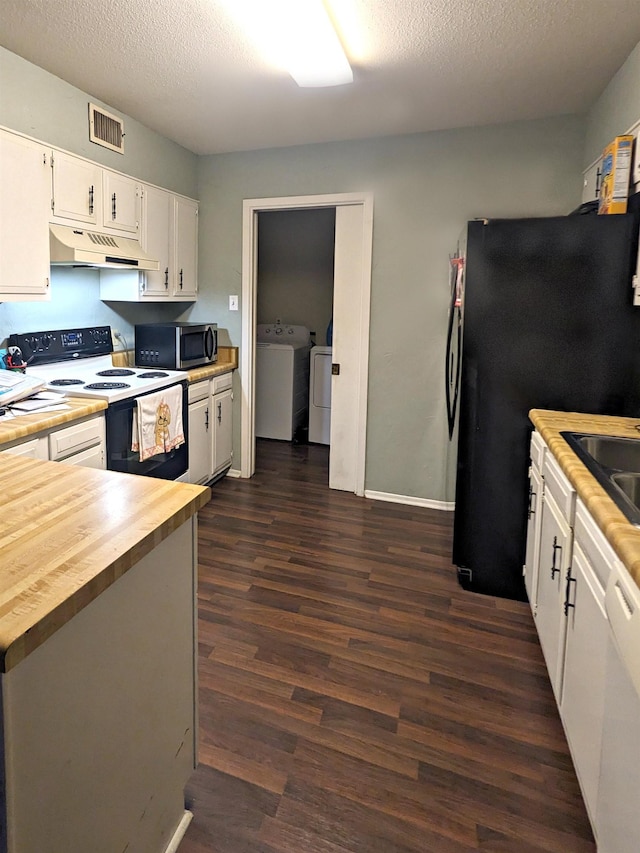 kitchen featuring range with electric stovetop, dark hardwood / wood-style floors, sink, white cabinets, and washer and clothes dryer