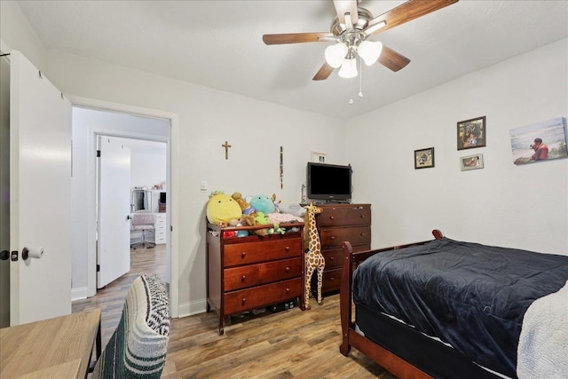 1407 N 15th St, Nederland, TX 77627 - bedroom with wood finished floors, baseboards, and a ceiling fan