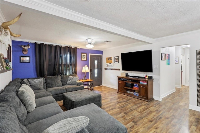 1407 N 15th St, Nederland, TX 77627 - living area featuring crown molding, a textured ceiling, wood finished floors, baseboards, and a ceiling fan