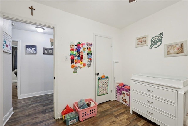 1407 N 15th St, Nederland, TX 77627 - rec room with dark wood-type flooring and baseboards