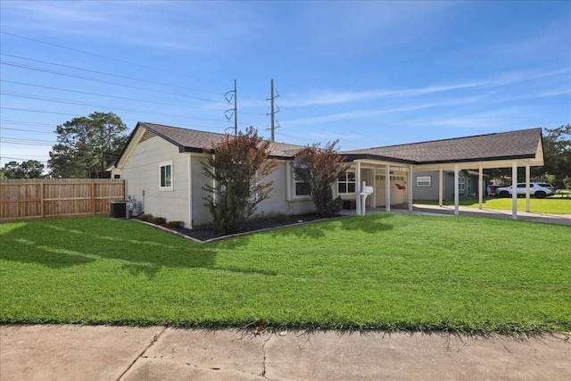 1407 N 15th St, Nederland, TX 77627 - ranch-style home with central AC, a carport, driveway, and a shingled roof