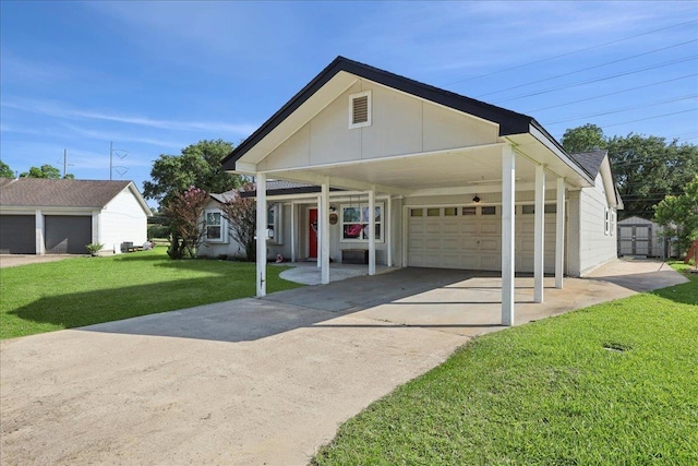 1407 N 15th St, Nederland, TX 77627 - view of front of property with a front lawn, covered porch, and driveway