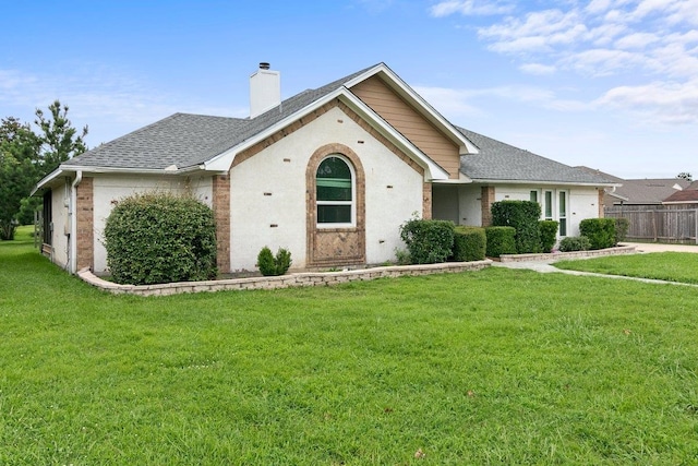 ranch-style house featuring a front lawn