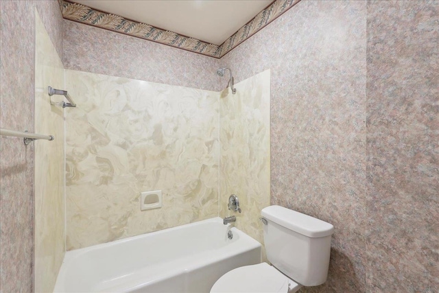 bathroom featuring toilet and shower / bathtub combination