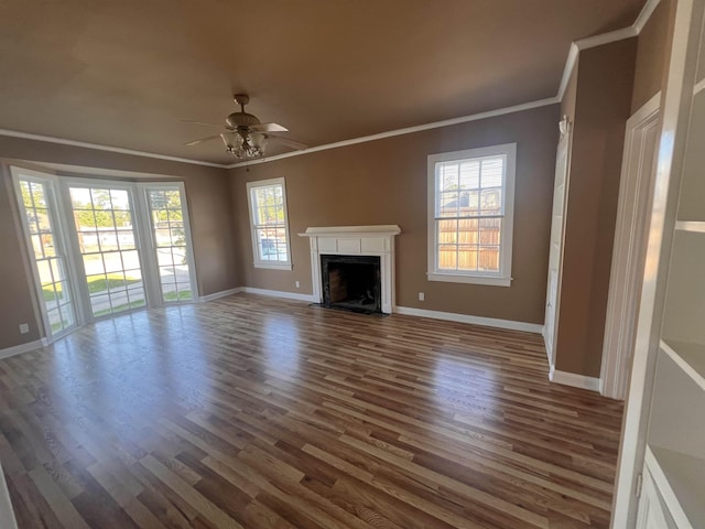 unfurnished living room with dark hardwood / wood-style floors, ceiling fan, and ornamental molding