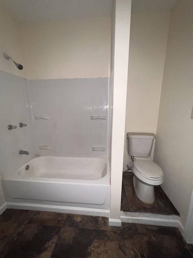 bathroom with toilet and bathtub / shower combination