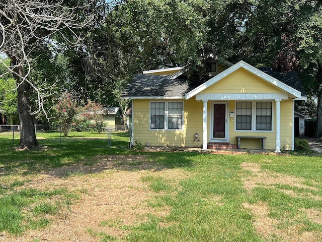 bungalow-style house with a front yard